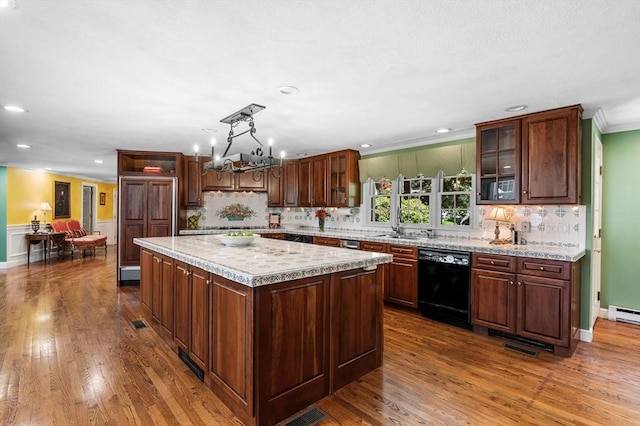 38 Lincoln Cir E, Andover, MA 01810 - kitchen with black dishwasher, paneled built in refrigerator, light countertops, dark wood-type flooring, and backsplash
