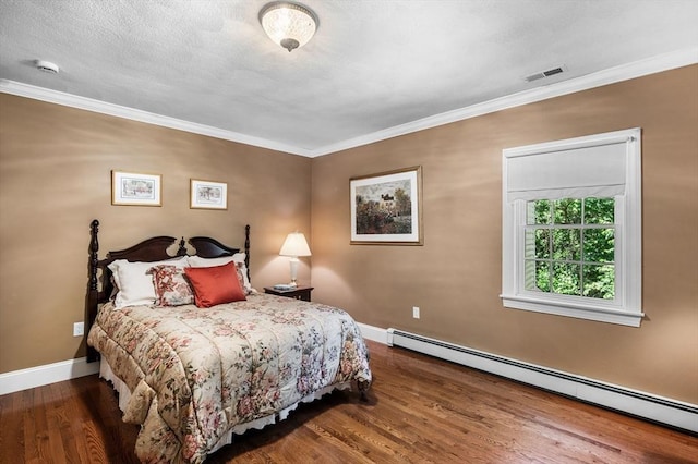38 Lincoln Cir E, Andover, MA 01810 - bedroom featuring baseboard heating, wood finished floors, and ornamental molding