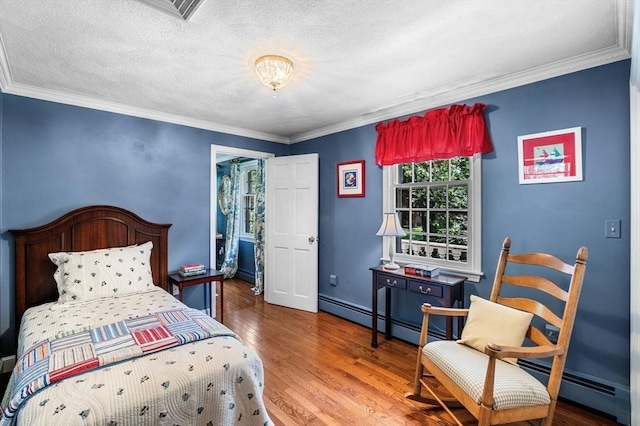 38 Lincoln Cir E, Andover, MA 01810 - bedroom with multiple windows, baseboard heating, wood finished floors, crown molding, and a textured ceiling