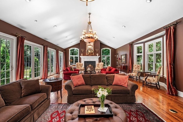 38 Lincoln Cir E, Andover, MA 01810 - living room with wood finished floors, a fireplace, and lofted ceiling