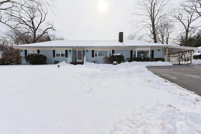 single story home with a carport