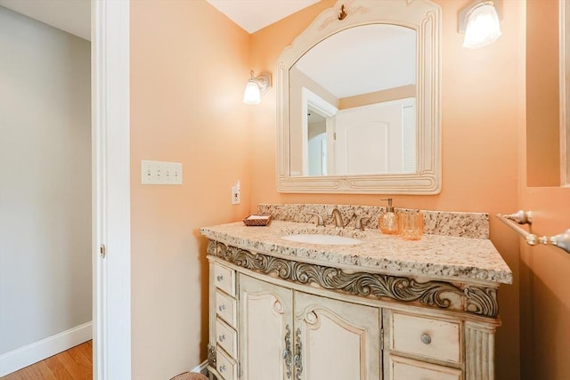 bathroom featuring vanity and wood-type flooring