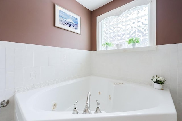 bathroom with a tub to relax in