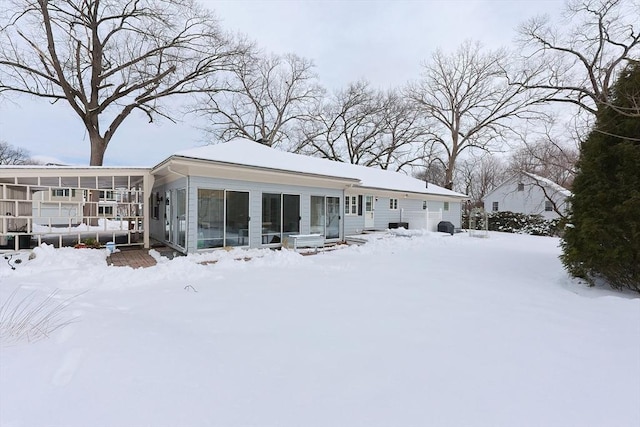 view of snow covered house