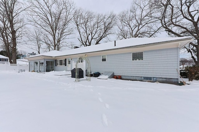 view of snow covered house