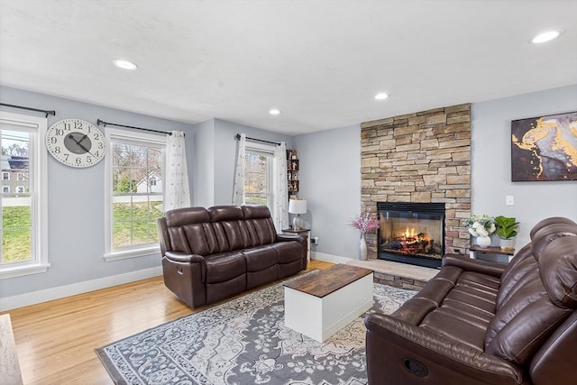 29 Regatta Dr, Attleboro, MA 02703 - living area featuring a fireplace, baseboards, wood finished floors, and a healthy amount of sunlight