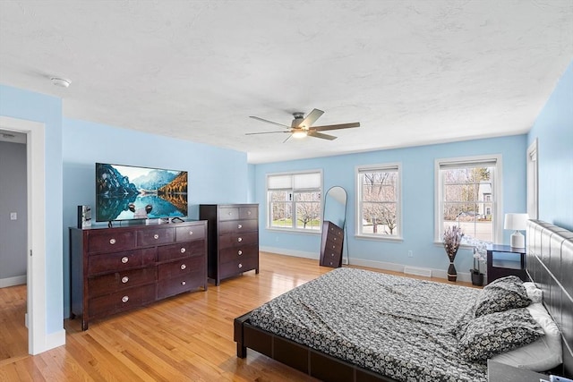 29 Regatta Dr, Attleboro, MA 02703 - bedroom featuring visible vents, baseboards, ceiling fan, light wood-style floors, and a textured ceiling