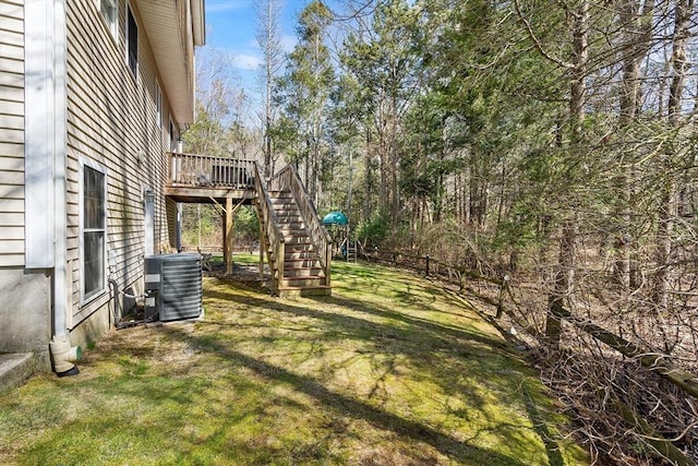29 Regatta Dr, Attleboro, MA 02703 - view of yard featuring stairs, central AC unit, a deck, and fence