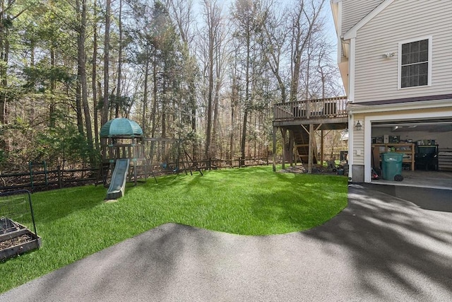 29 Regatta Dr, Attleboro, MA 02703 - view of yard with a playground, a wooden deck, and fence