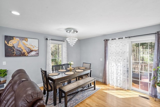 29 Regatta Dr, Attleboro, MA 02703 - dining area with baseboards, a notable chandelier, light wood-type flooring, and visible vents