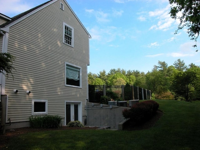 rear view of property with a yard