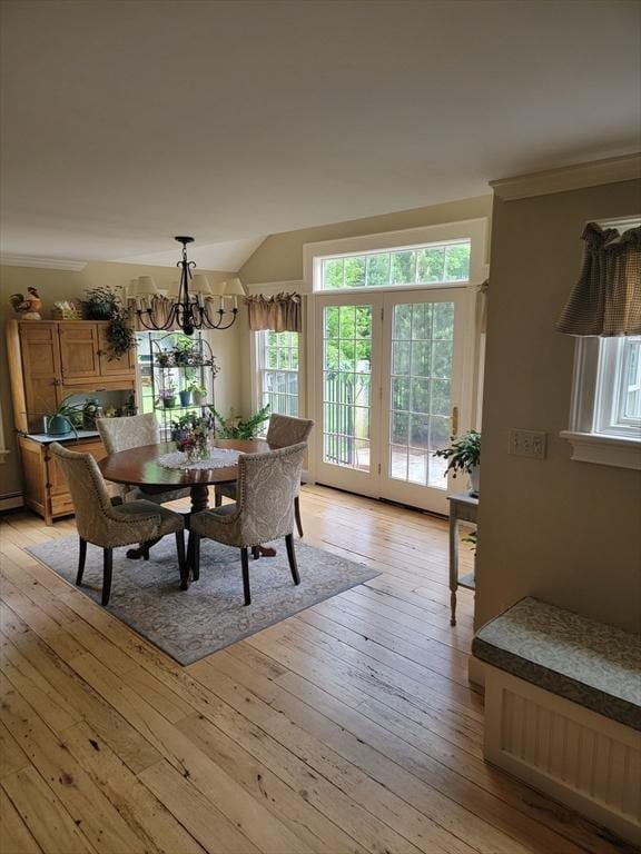 dining room featuring light hardwood / wood-style floors and an inviting chandelier