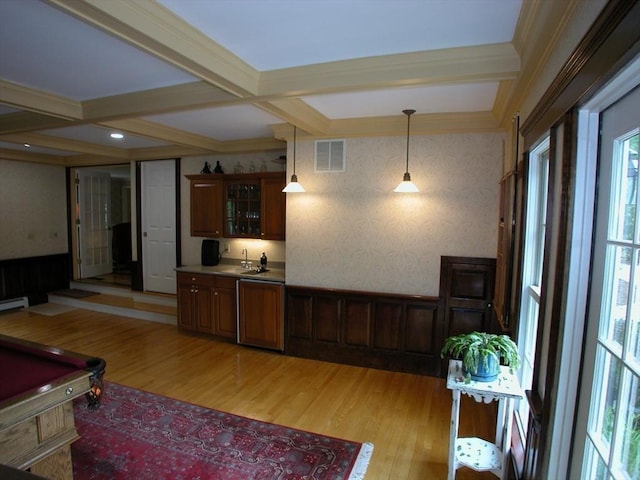 interior space featuring a baseboard radiator, indoor wet bar, beamed ceiling, light hardwood / wood-style floors, and coffered ceiling