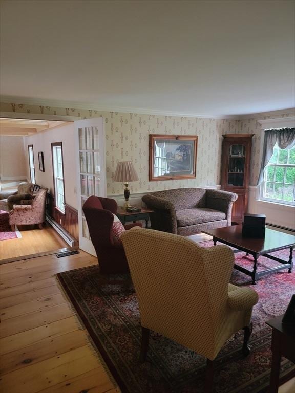 living room with hardwood / wood-style floors and ornamental molding