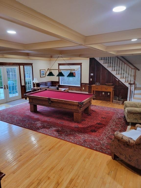 playroom featuring billiards, beam ceiling, french doors, and light wood-type flooring