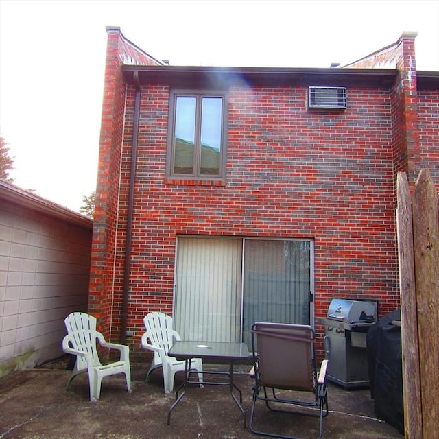 back of house with a patio