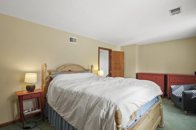 bedroom with baseboards, visible vents, and carpet flooring