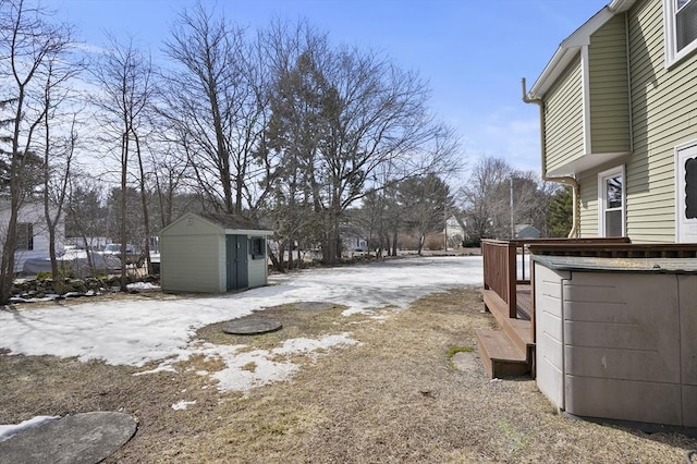 view of yard featuring an outbuilding and a storage unit