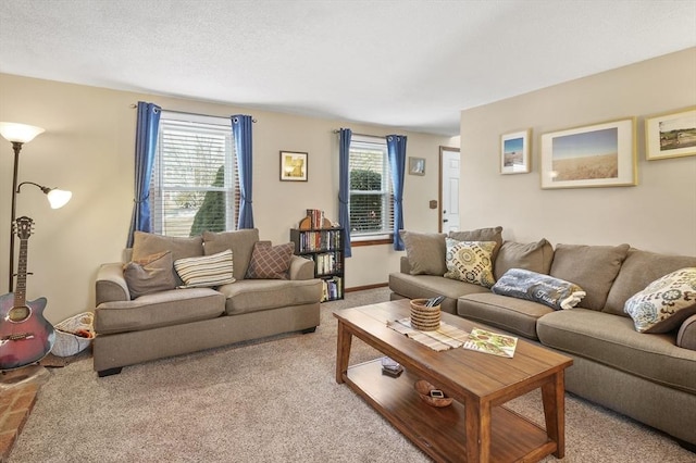 living room with a textured ceiling and carpet flooring