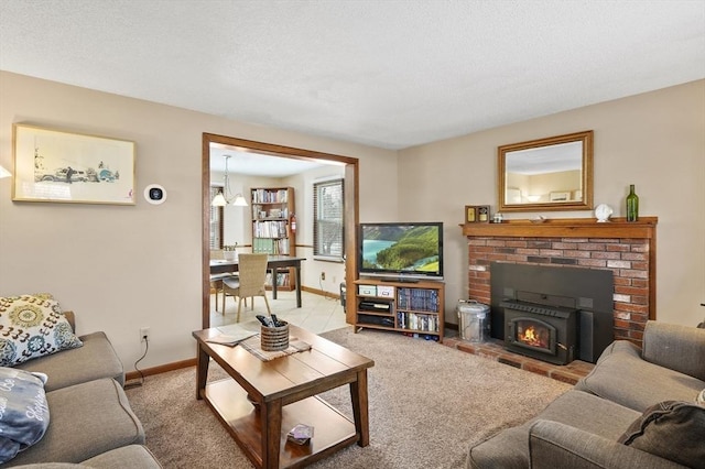 carpeted living room with a textured ceiling and baseboards