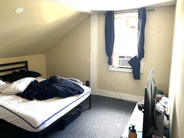 carpeted bedroom featuring vaulted ceiling and cooling unit