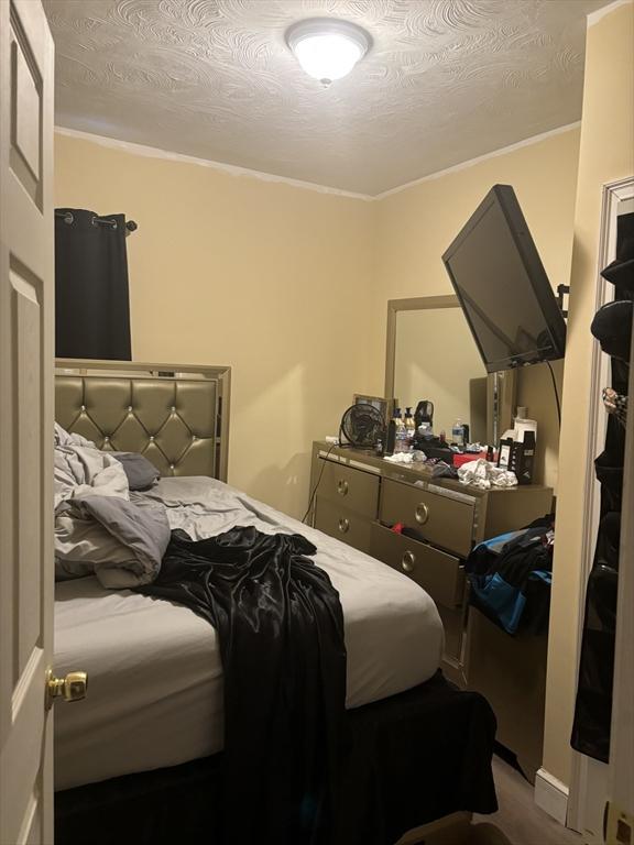 bedroom featuring a textured ceiling