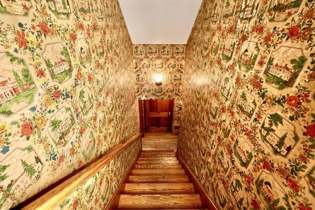 stairway with wallpapered walls