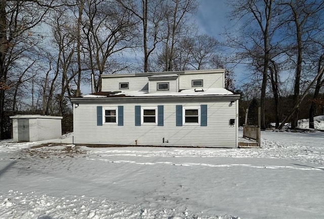 view of front of house featuring a storage shed