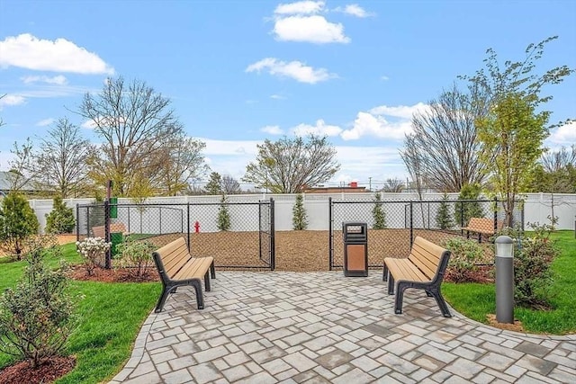 surrounding community with a patio area, fence, and a yard