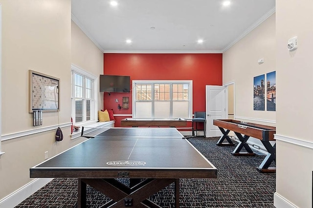 recreation room featuring crown molding, recessed lighting, and baseboards