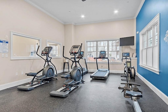 exercise room with crown molding, recessed lighting, baseboards, and a wealth of natural light