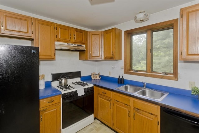 245 State Rd, Phillipston, MA 01331 - kitchen with black appliances, under cabinet range hood, brown cabinetry, and dark countertops