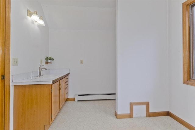 245 State Rd, Phillipston, MA 01331 - bathroom with a baseboard heating unit, vanity, tile patterned floors, and lofted ceiling