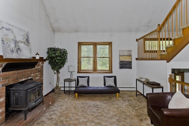 245 State Rd, Phillipston, MA 01331 - living room with a wood stove, a baseboard heating unit, a baseboard radiator, vaulted ceiling, and carpet