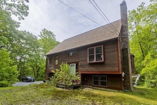 245 State Rd, Phillipston, MA 01331 - back of house featuring a chimney, a lawn, roof with shingles, and a wooden deck