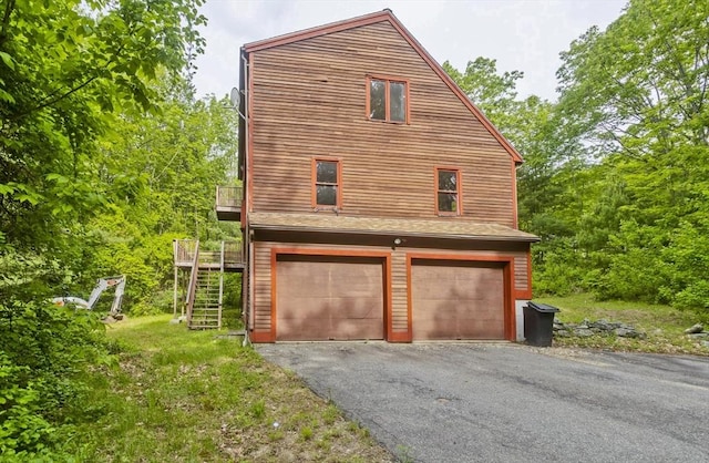 245 State Rd, Phillipston, MA 01331 - view of property exterior with a garage, stairs, asphalt driveway, and a balcony
