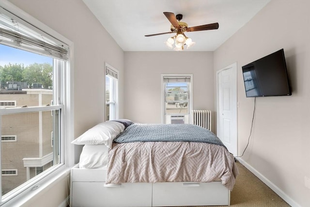 13 Knowlton St, Boston, MA 02127 - bedroom with radiator, carpet, baseboards, a ceiling fan, and a closet