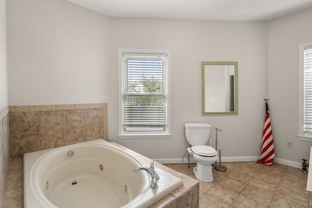 13 Knowlton St, Boston, MA 02127 - full bath with a jetted tub, toilet, and tile patterned flooring
