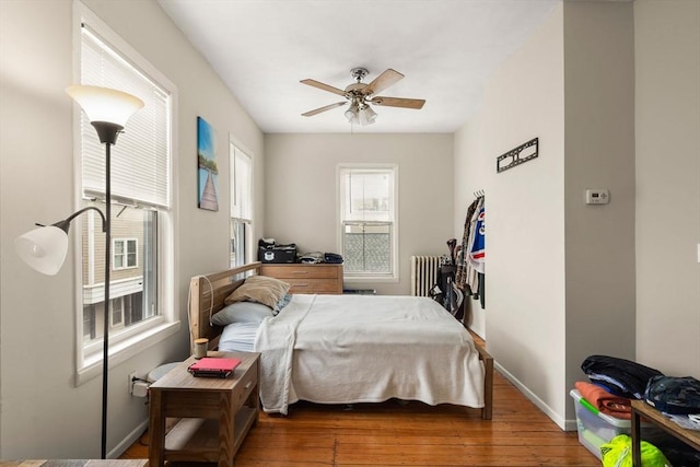 13 Knowlton St, Boston, MA 02127 - bedroom with radiator heating unit, hardwood / wood-style flooring, baseboards, and a ceiling fan