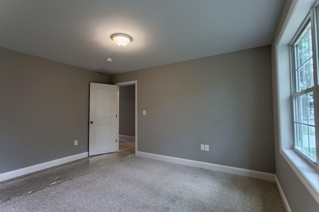 spare room featuring carpet flooring