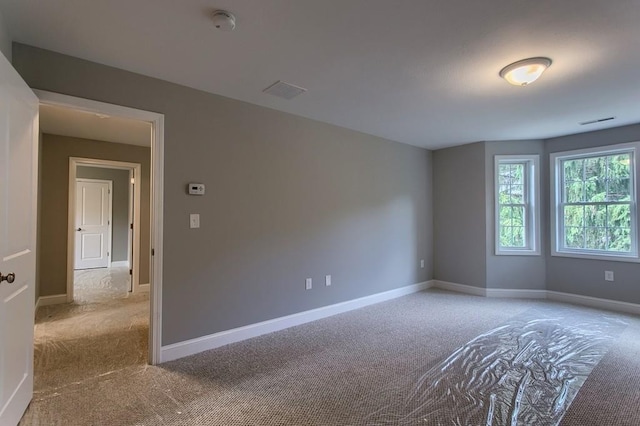 empty room with light colored carpet