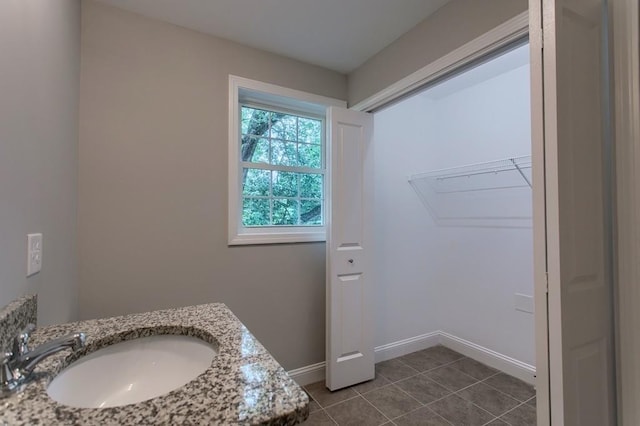 bathroom featuring tile patterned floors and vanity