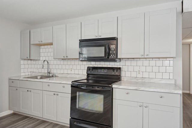 kitchen with black appliances, wood-type flooring, white cabinetry, decorative backsplash, and sink