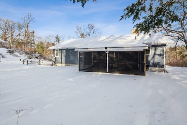 view of snow covered house