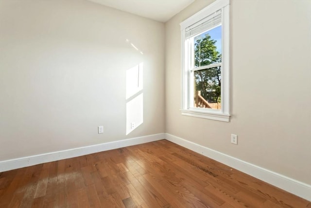 127-129 Franklin St, Malden, MA 02148 - empty room with baseboards and hardwood / wood-style flooring
