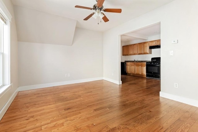 127-129 Franklin St, Malden, MA 02148 - unfurnished living room with healthy amount of natural light, light wood-type flooring, a ceiling fan, and lofted ceiling
