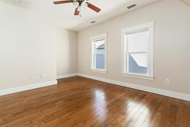 127-129 Franklin St, Malden, MA 02148 - unfurnished room with a ceiling fan, wood-type flooring, and baseboards