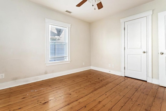 127-129 Franklin St, Malden, MA 02148 - unfurnished room with a ceiling fan, wood-type flooring, and baseboards