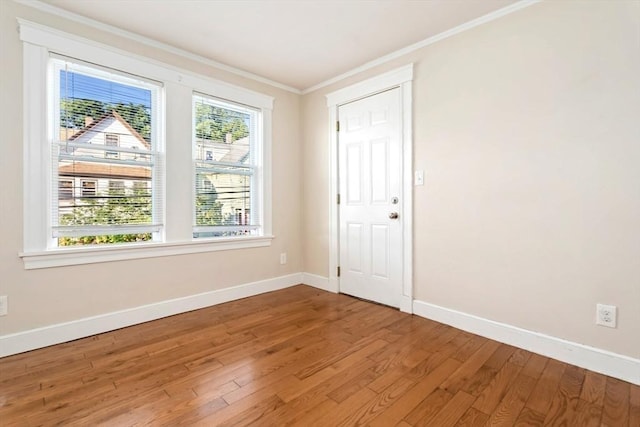 127-129 Franklin St, Malden, MA 02148 - spare room with wood finished floors, ornamental molding, and baseboards