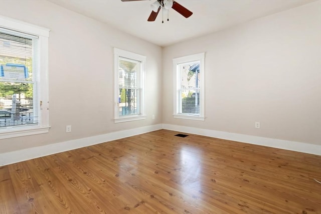 127-129 Franklin St, Malden, MA 02148 - unfurnished room featuring plenty of natural light, baseboards, a ceiling fan, and wood finished floors